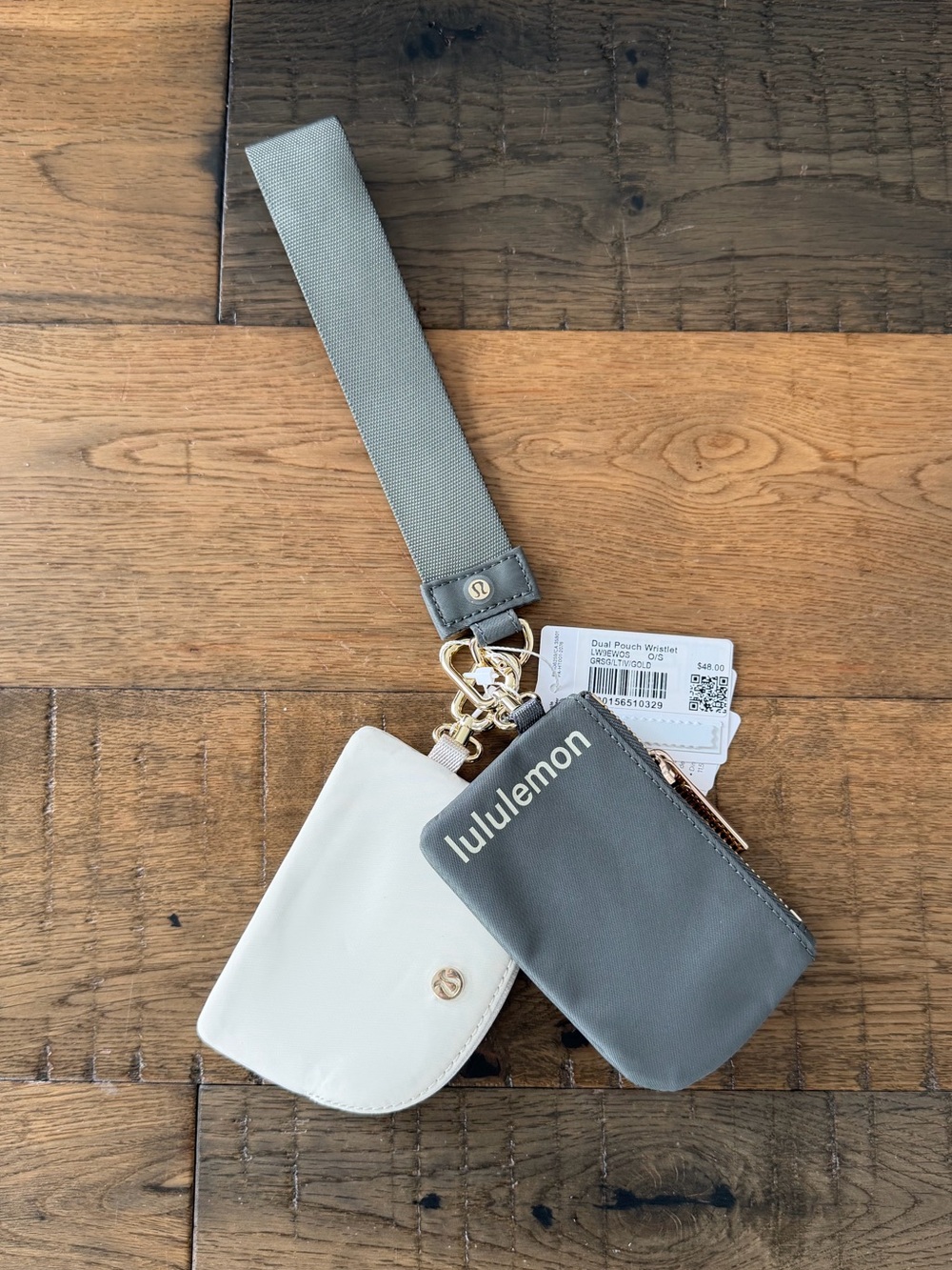NWT Lululemon dual pouch wristlet in gray and cream with gold hardware